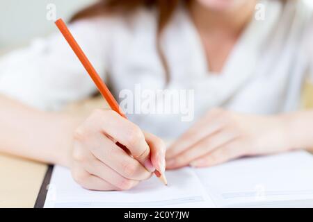 young beautiful asian girl student in classroom Stock Photo