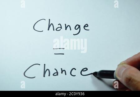 pen writing change equal chance word on white paper Stock Photo