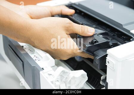 Technicians replacing toner in laser printer concept office supplies repair Stock Photo