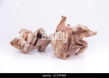 Squeezed Ten Rupees currency throw trash Stock Photo