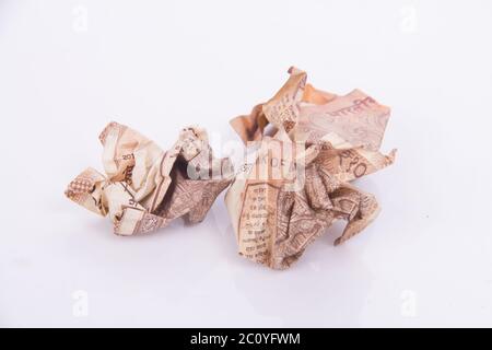 Squeezed Ten Rupees currency throw trash Stock Photo