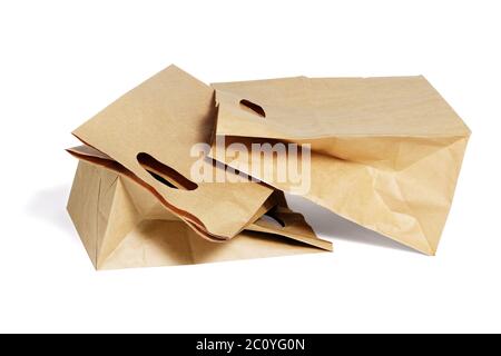 Three Brown Paper Bags Lying on White Background Stock Photo