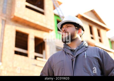 Portrait of foreman wearing hardhat on constuction site. Stock Photo