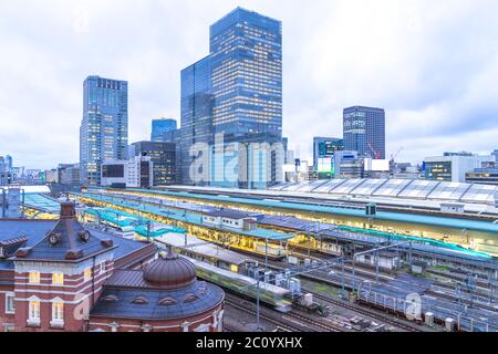 modern office buildings near tokyo railway station in cloud sky Stock Photo