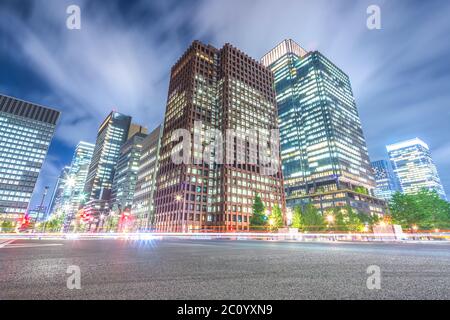 busy traffic on road in downtown of tokyo at twilight Stock Photo