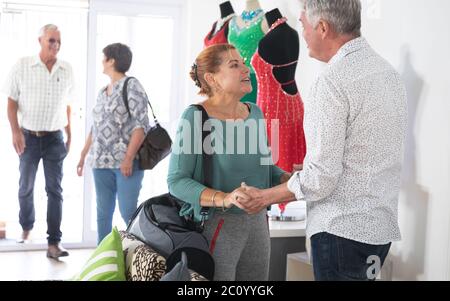Caucasian senior couples greeting before ballroom dancing class Stock Photo