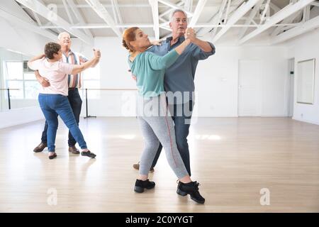 Caucasian senior couples ballroom dancing Stock Photo
