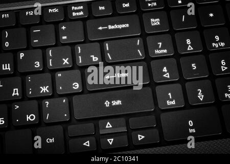 Electronic collection - laptop keyboard. The focus on the Enter key. Stock Photo