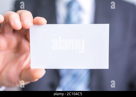 businessman holding white blank paper Stock Photo