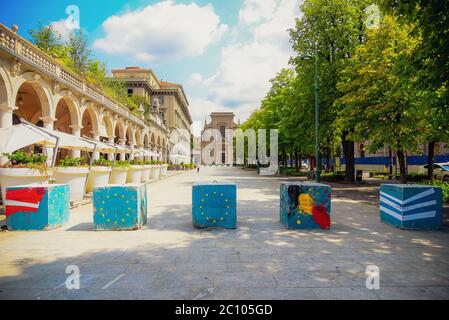 View of the 'Sentierone', one of the main streets of Bergamo's movida, with colorful anti-terrorism bollards, Bergamo, Lombardia, Italy, 16/08/2018
