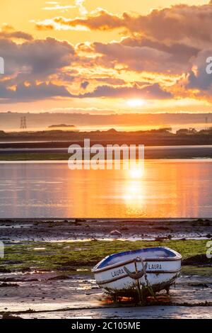 Appledore, North Devon, England. Saturday 13th June 2020. UK Weather. After torrential rain overnight, at dawn calm returns to the River Torridge estuary as the sun breaks through the clouds over Appledore in North Devon. Credit: Terry Mathews/Alamy Live News Stock Photo
