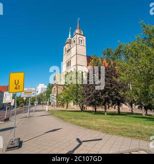 Johannis Church and crossroad street in Magdeburg, Germany, Summer, blue sky Stock Photo