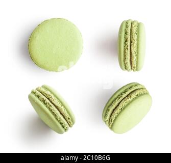 Set of green french macarons isolated on white background. Top view. Stock Photo