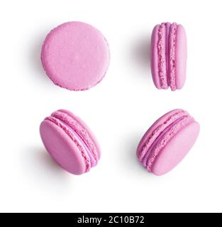 Set of pink french macarons isolated on white background. Top view. Stock Photo