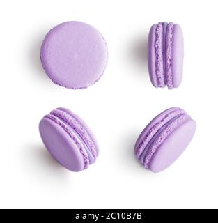 Set of violet french macarons isolated on white background. Top view. Stock Photo