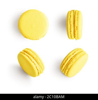 Set of yellow french macarons isolated on white background. Top view. Stock Photo