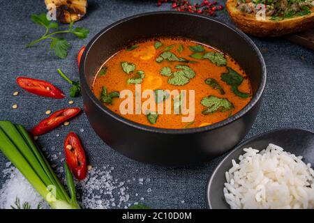 Stew soup with meat, potatoes, mushrooms and red pepper in bowl Stock Photo