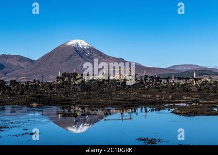 A beautiful Spring morning at Broadford Bay below snow capped mountains on the Isle of Skye Stock Photo
