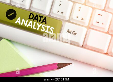 Writing note showing Data Analysis. Business concept for Business intelligence and analytics with a new startup project discussion Stock Photo