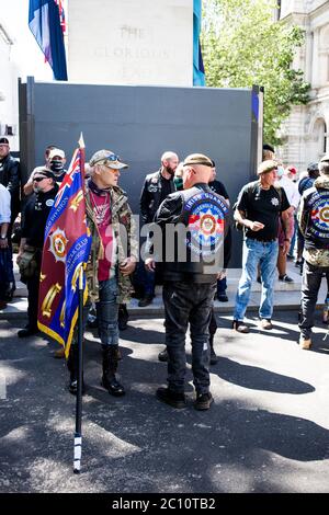 London, UK. 13th June, 2020. Ex service man stand by The Cenotaph. The protests are retaliation to the recent George Floyd deonstrations by Black lives Matter. Credit: Thabo Jaiyesimi/Alamy Live News Stock Photo