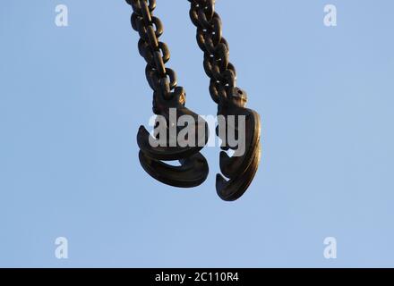 hook and boom lifting machinery at a construction site on sky background Stock Photo
