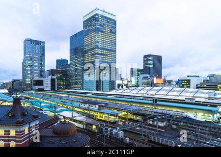 modern office buildings near railway station in tokyo at twilight Stock Photo