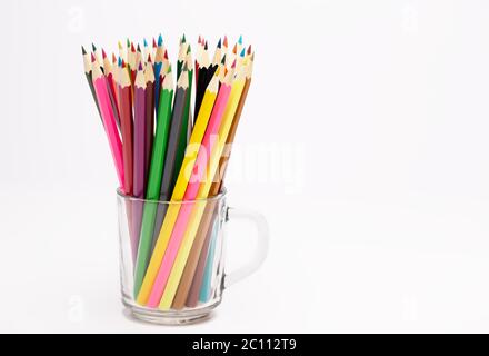 A Colorful wooden pencils stand in a pencil holder Stock Photo