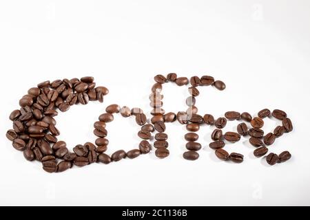 word coffee written with coffee beans on a white background Stock Photo