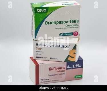 KYIV, UKRAINE - MAY 28, 2020: Antihypertensive and gastroenterology generic drugs with perindopril, indapamide, nebivolol and omeprazole boxes closeup Stock Photo