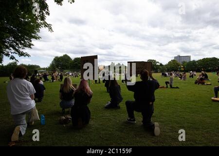 London, UK. 13th June, 2020. Protestors gather in Alexandra Park, Surbiton take part in a protest in support of the Black Lives Matter movement. Localised protests have sprung up across London this weekend due to fears of violence from far-right groups in central London. Credit: Liam Asman/Alamy Live News Stock Photo