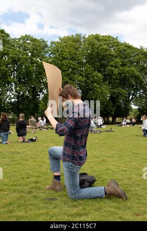 London, UK. 13th June, 2020. Protestors gather in Alexandra Park, Surbiton take part in a protest in support of the Black Lives Matter movement. Localised protests have sprung up across London this weekend due to fears of violence from far-right groups in central London. Credit: Liam Asman/Alamy Live News Stock Photo