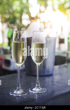 Glasses of champagne in outdoor resort bar Stock Photo