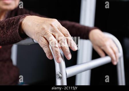 senior woman using a walker at home Stock Photo