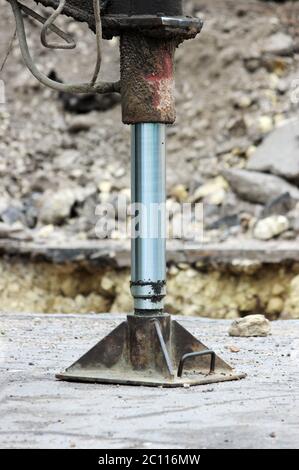 Truck strong outrigger stabilizing legs extended. Working leg  from a crane. Stock Photo