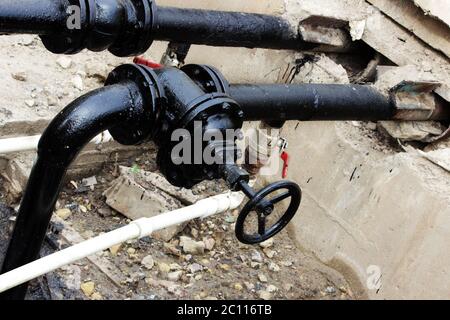black pipe with a tap, processed bitumen polymer mixture. Stock Photo