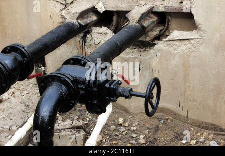 black pipe with a tap, processed bitumen polymer mixture. Stock Photo