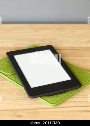 ebook reader on a wooden table Stock Photo