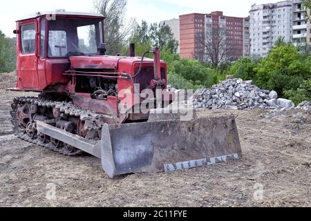 Old  bulldozer working on construction site Old  bulldozer working on construction site Stock Photo