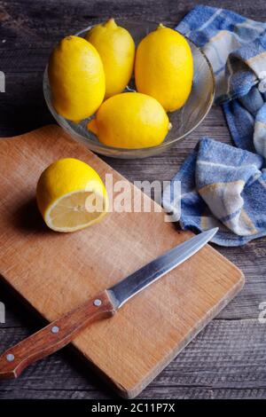 Lemons on old wooden table and blue tablecloth. mystic light studio shoot Stock Photo