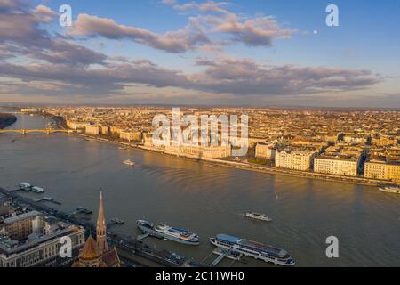 Aerial drone sunset view of Hungarian Parliament by Danube river in Budapest Stock Photo