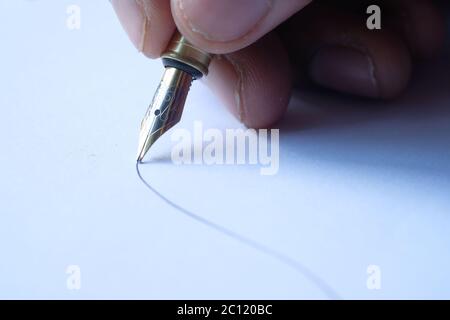person hand writing on paper, close up  Stock Photo