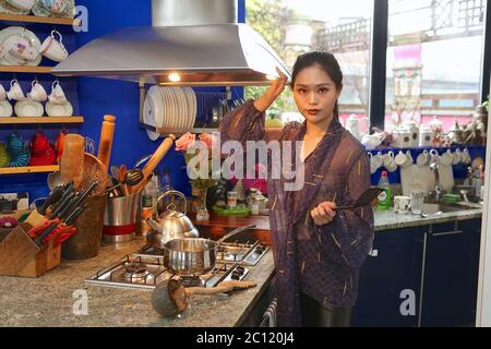 Anqi Zhu Modelling evening wear designed by Zandra Rhodes in ,Zandra Rhodes Kitchen .Rhodes use to design Princess Diana's clothes as well as various other celebrities . Stock Photo