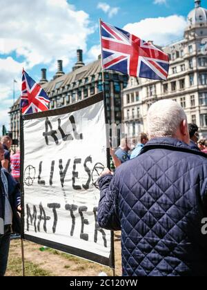 London, UK. 13th June, 2020. Sign proclaiming that All Lives Matter. Counter-protesters consisting of nationalist supporters members of the English Defence League (EDL) and fans of Tommy Robinson gather to protest about the damage done to statues, such as Winston Churchills, and the subsequent removal of statues triggered by damage done during the Black Lives Matter Protests in London, UK. Credit: Yousef Al Nasser/ Alamy Live News Stock Photo