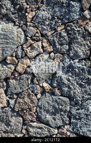 seamless pattern of weathered volcanic stone with numerous pores and ...