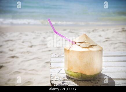 Fresh coconut cocktail on tropical beach Stock Photo