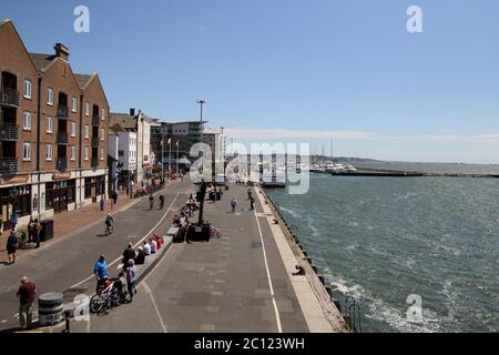 Poole Quay, the border between the sea and the land. A popular and traditional summer attraction for tourists Stock Photo