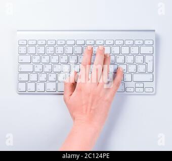 Close-up of typing female hand on keyboard Stock Photo