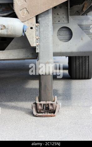 Truck strong outrigger stabilizing legs extended. Working leg  from a trailer  the . Stock Photo