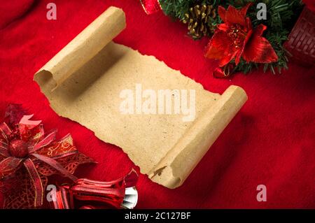 Christmas vintage paper scroll on red background Stock Photo