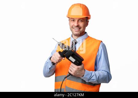 Repairman Worker Holding Electric Drill Posing Over White Studio Background Stock Photo